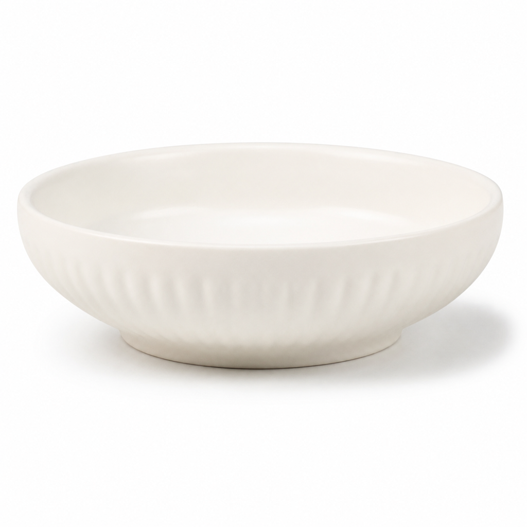 A white ceramic bowl with a subtle ribbed texture on the exterior, shown on a clean white background.