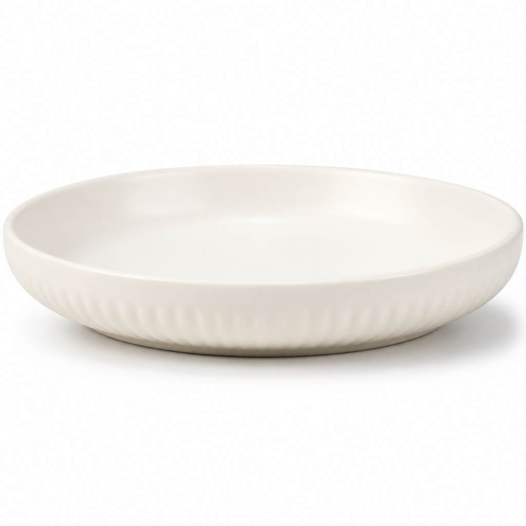 A round ceramic plate with a fluted rim, shown from a side angle on a clean white background.